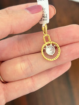 Yellow gold lab diamond pendant. Center stone is 8.0mm and set in white gold