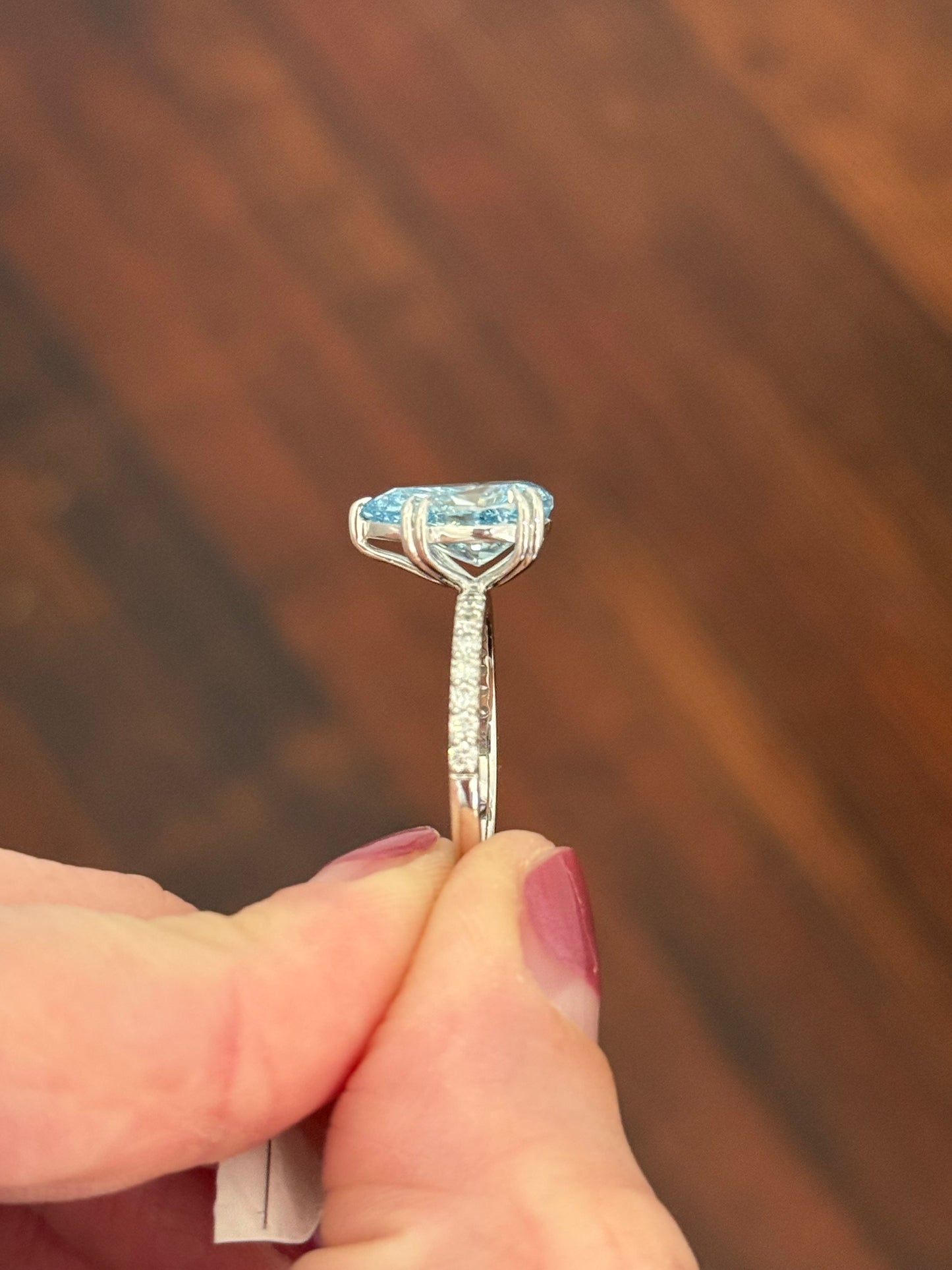 White gold pear shape blue lab diamond and white lab diamond ring