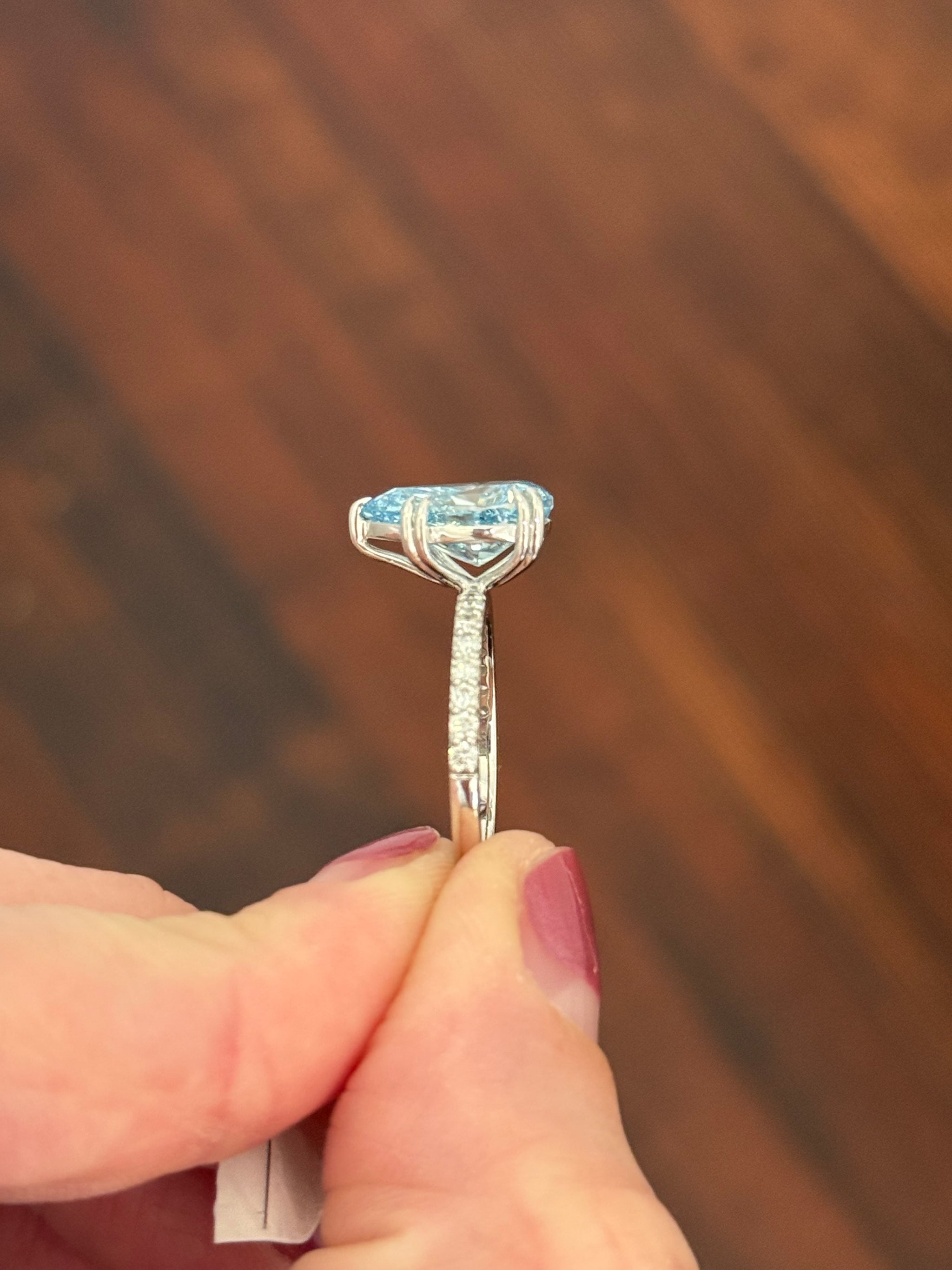 White gold pear shape blue lab diamond and white lab diamond ring