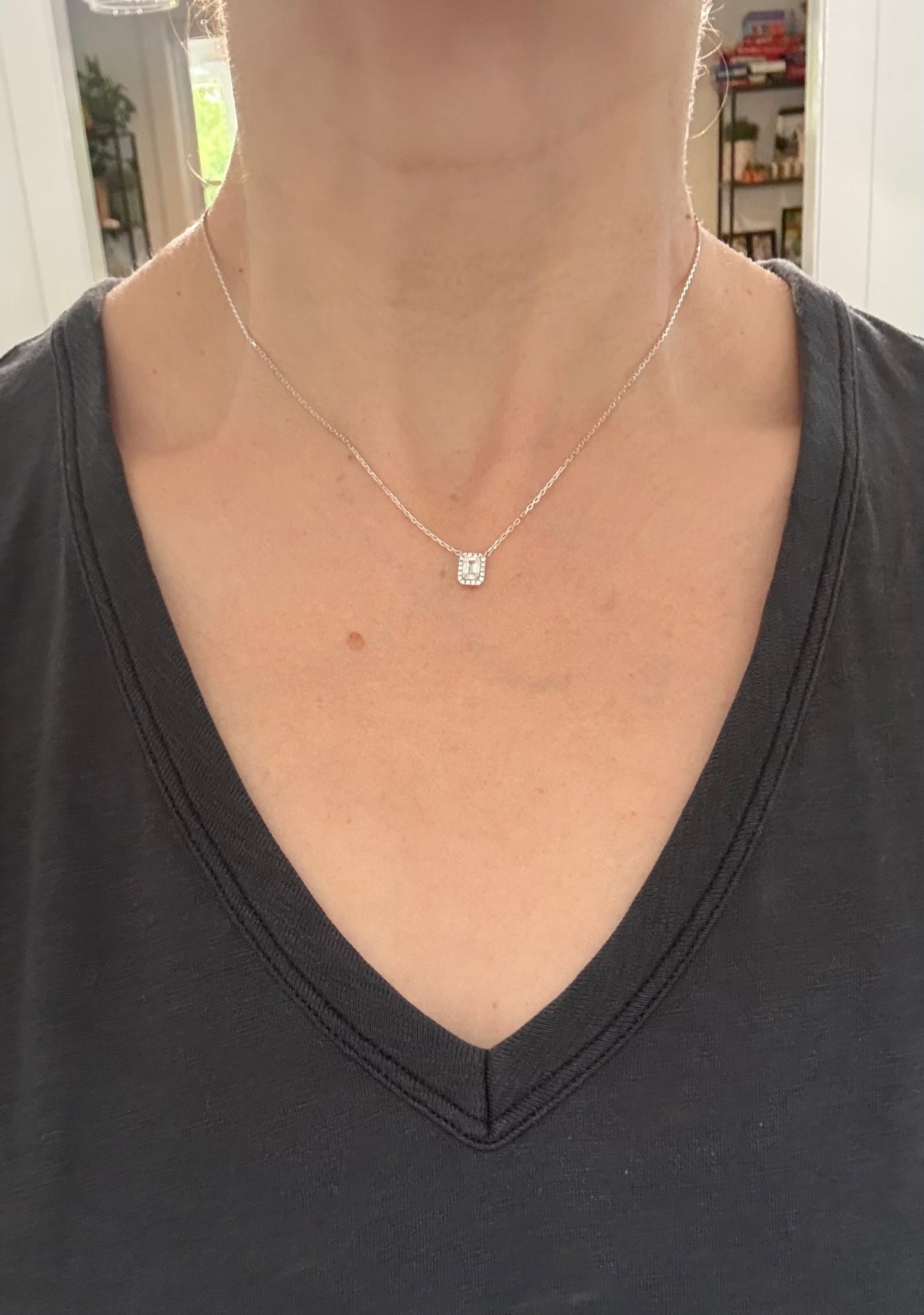 White gold emerald cut lab diamond necklace. Center stone is 0.50cts and measures 5.2x3.7mm. Chain is 16” with an adjustment of 4” to make as long as 20”.