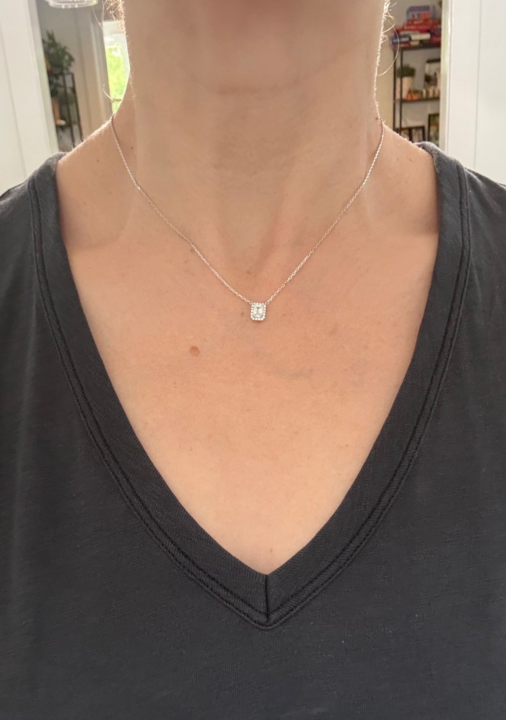 White gold emerald cut lab diamond necklace. Center stone is 0.50cts and measures 5.2x3.7mm. Chain is 16” with an adjustment of 4” to make as long as 20”.
