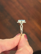 White gold oval blue lab diamond and white lab diamond ring