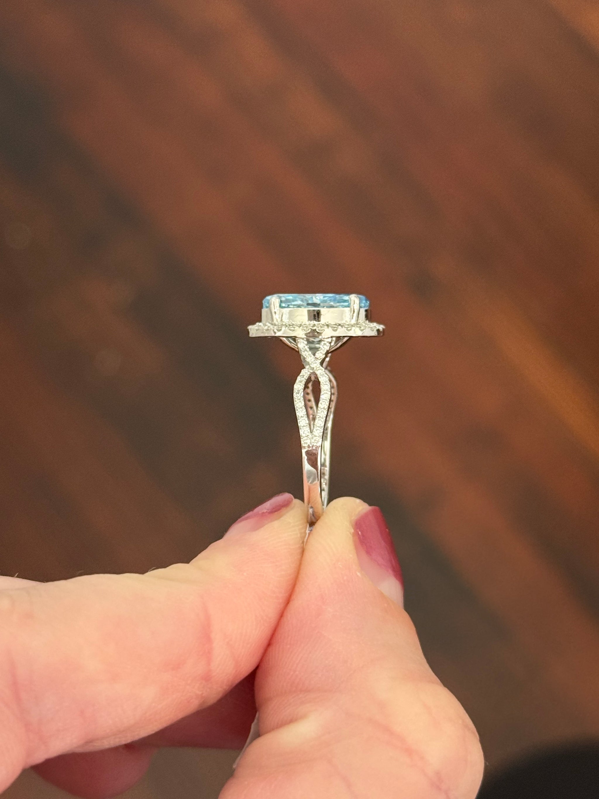 White gold oval blue lab diamond and white lab diamond ring