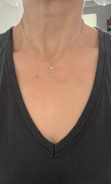 Yellow gold natural diamond and sapphire evil eye heart pendant
