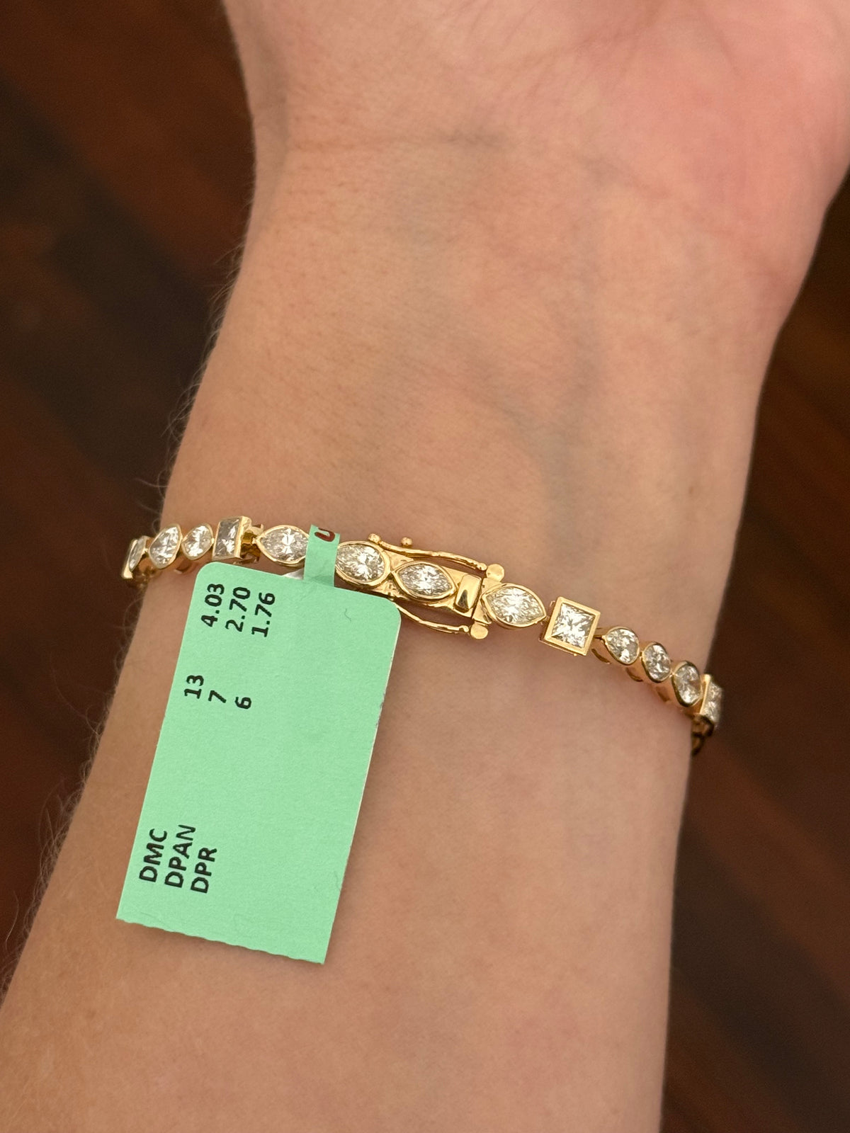 Yellow gold bezel set 8.49ct marquise, pear shape and princess cut natural diamond bracelet