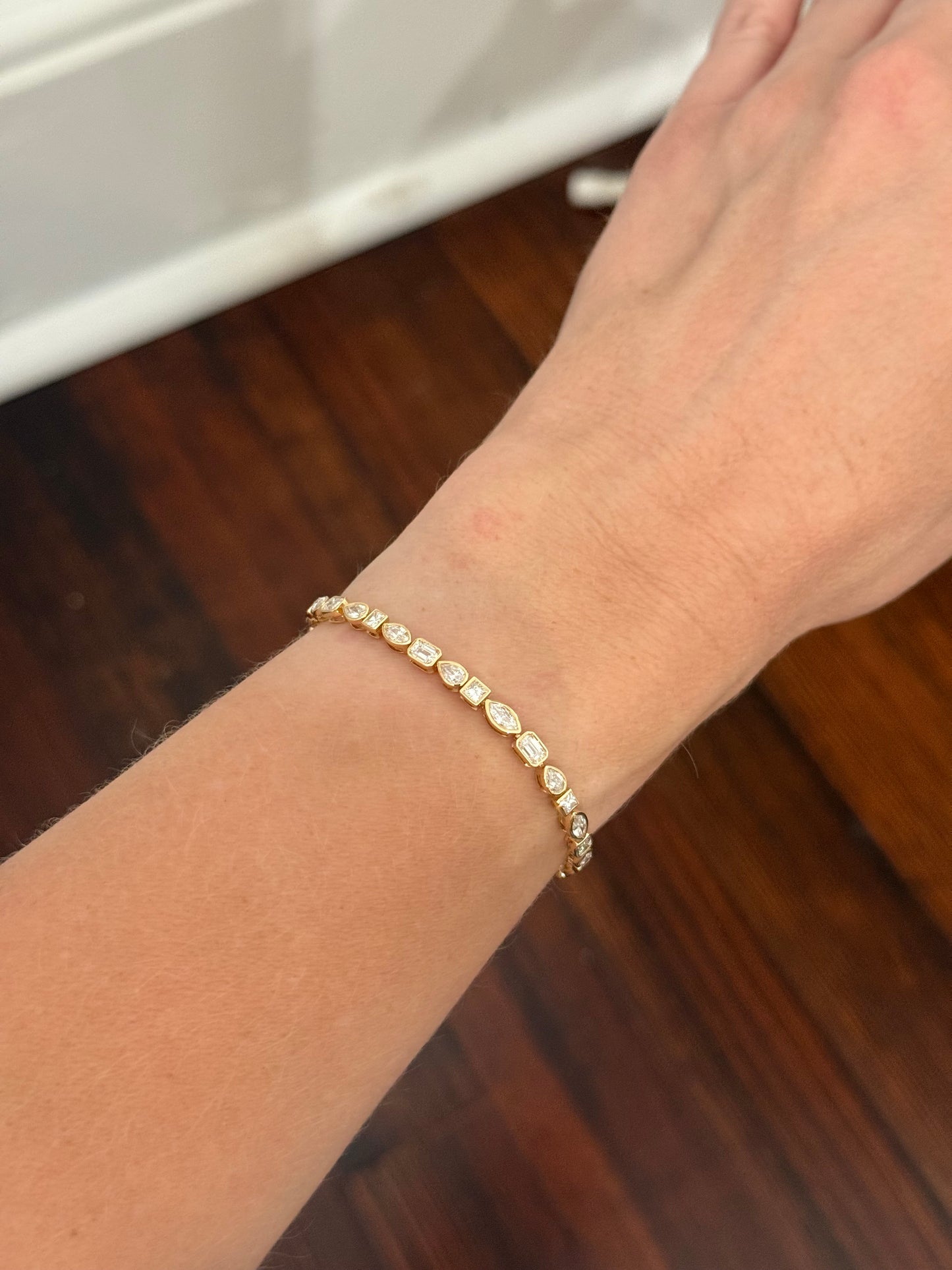 Yellow gold bezel set 5.3ct pear shape, marquise, princess and emerald cut natural diamond bracelet