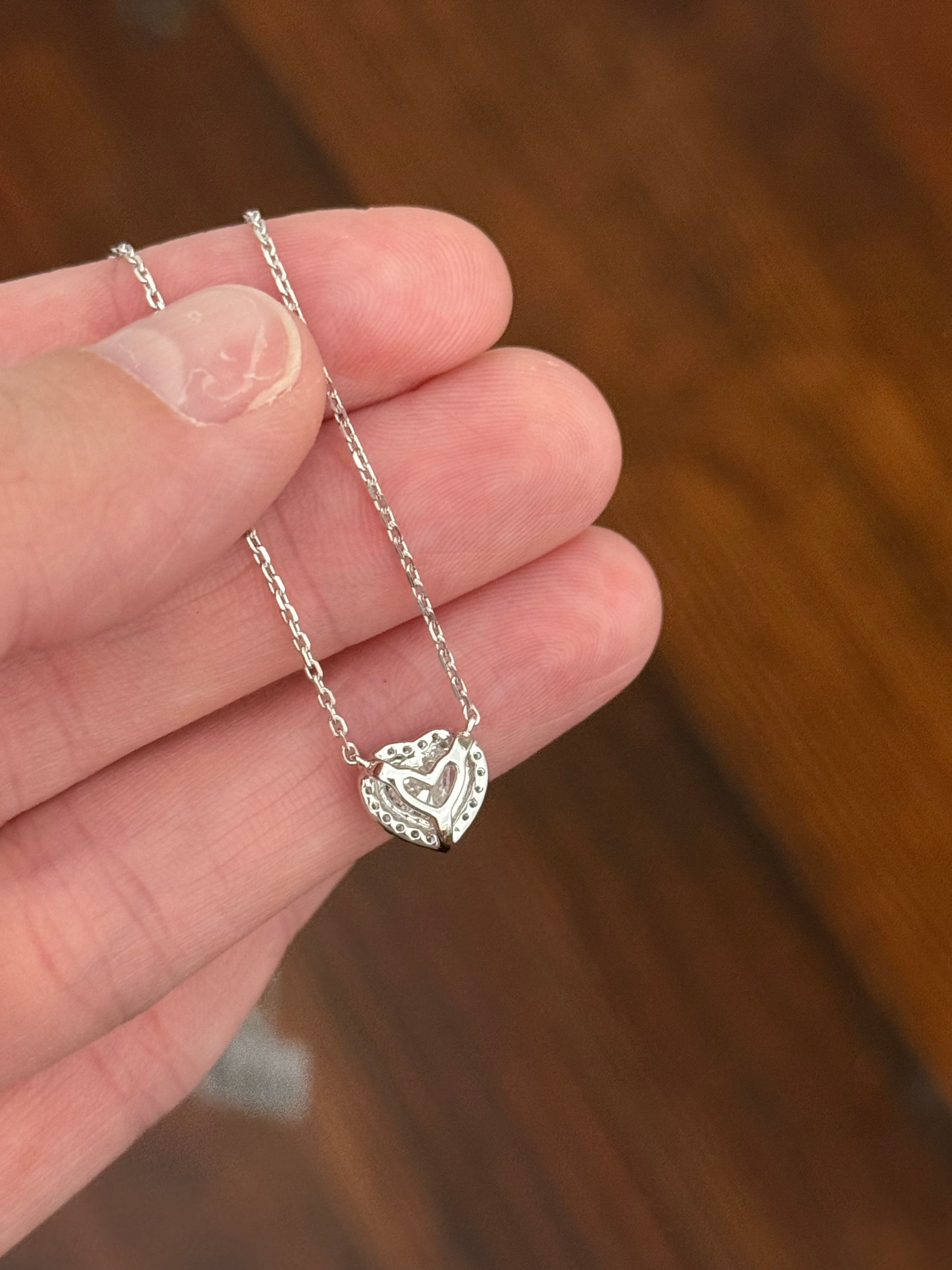 White gold heart shaped lab diamond necklace. Center stone is 1.05cts and measures 6x6.9mm. Chain is 16” with an adjustment of 4” to make as long as 20”.