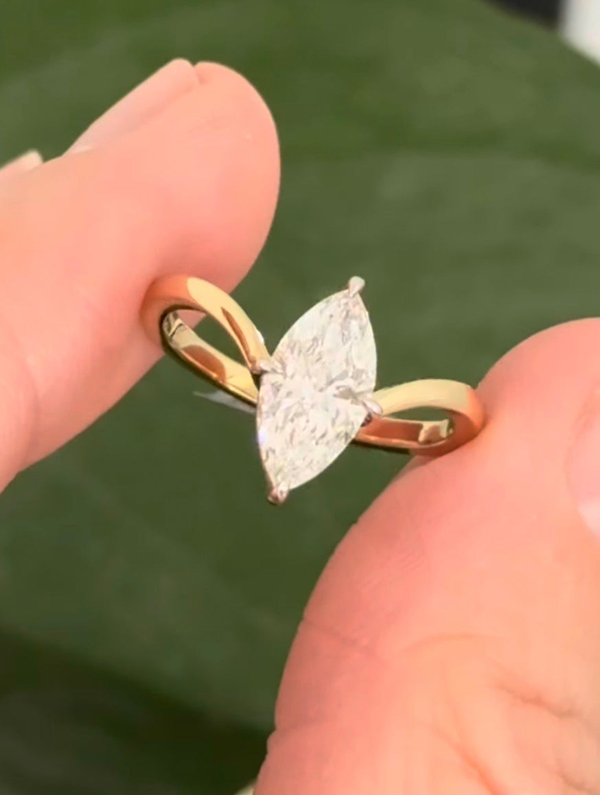 Yellow gold 1.49ct marquise lab diamond ring. Prongs are white gold.