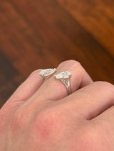 White gold 3.15ct step cut pear shape lab diamond bypass ring. Each measures 10.45x5.70mm