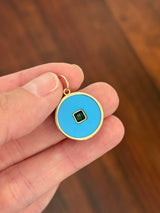 Yellow gold emerald pendant
