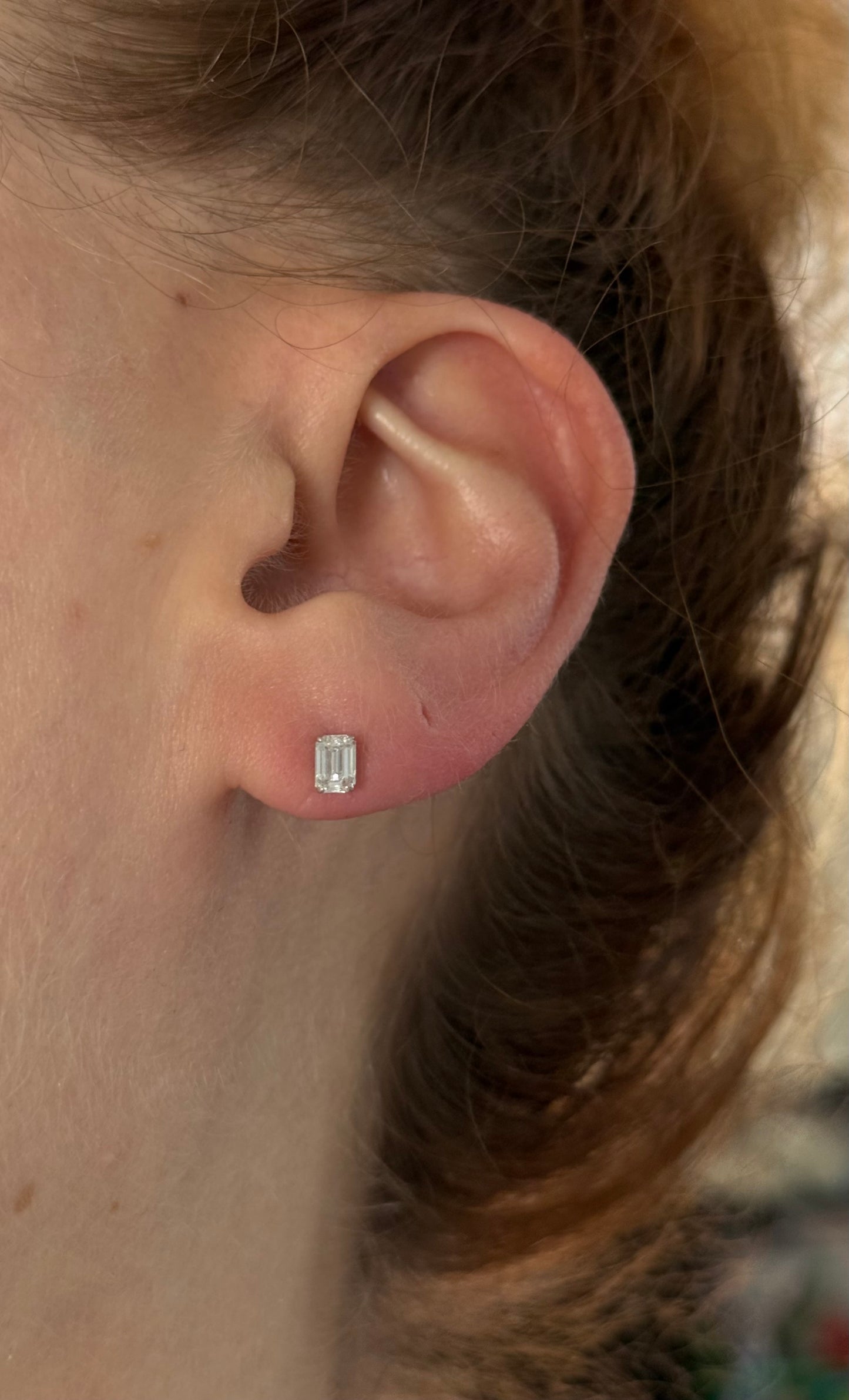 White gold 0.70ct emerald cut lab diamond stud earrings with screw backs