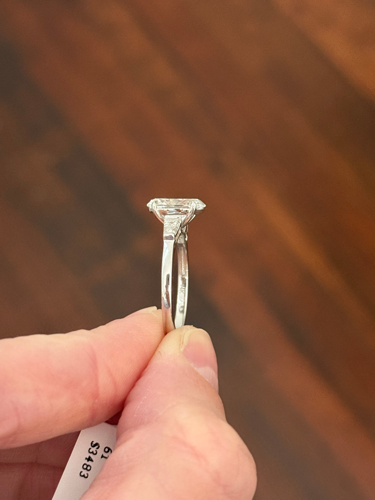White gold IGI certified 2.02ct oval lab diamond and tapered baguette lab diamond ring. Oval measures 10.31x7.04x4.34mm