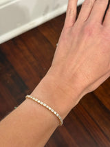 Yellow gold east west set 6.88ct emerald cut natural diamond bracelet