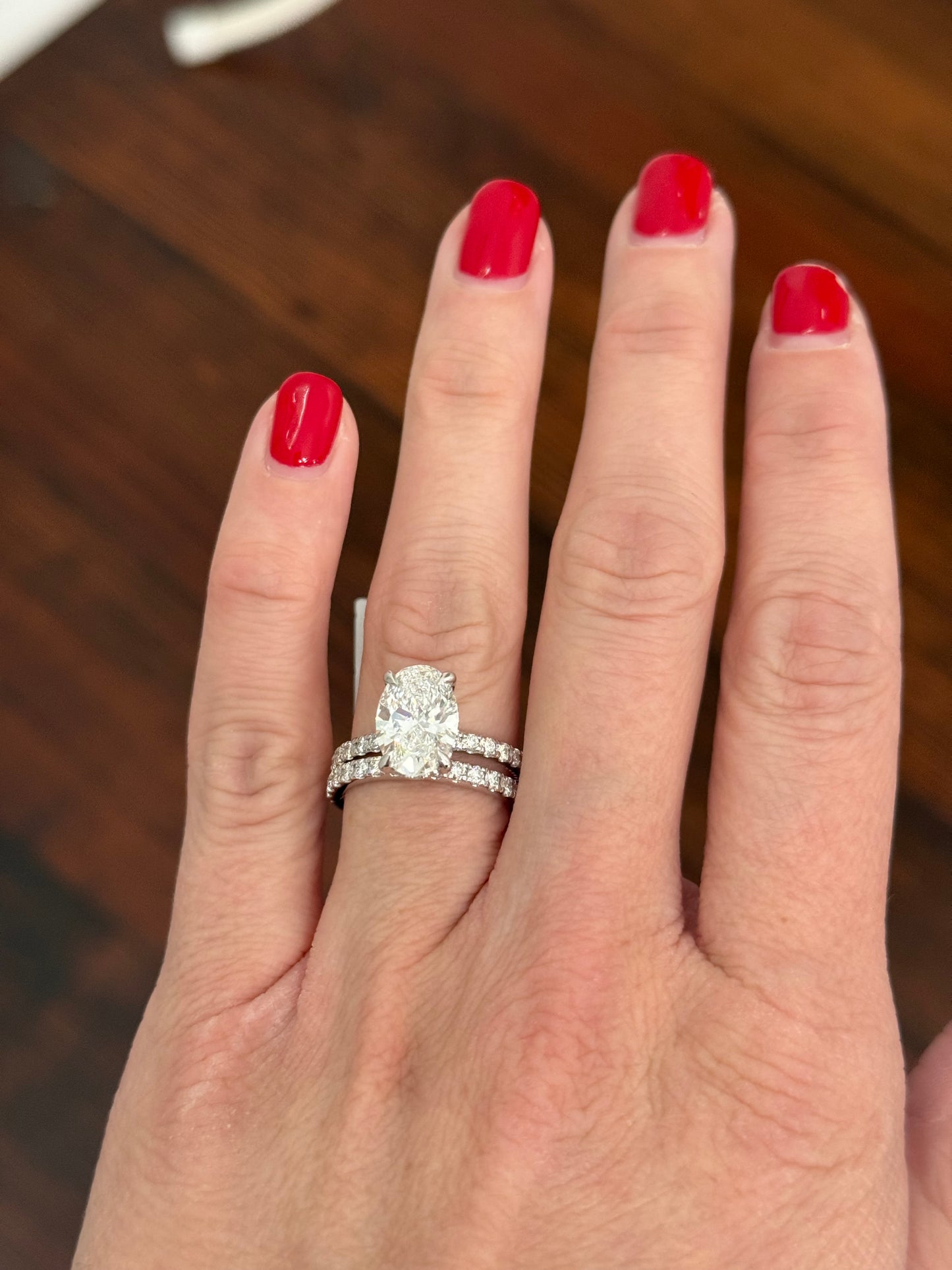 White gold oval lab diamond ring. Center stone is IGI certified and 3.03cts E VVS2