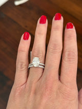 White gold oval lab diamond ring. Center stone is IGI certified and 3.03cts E VVS2