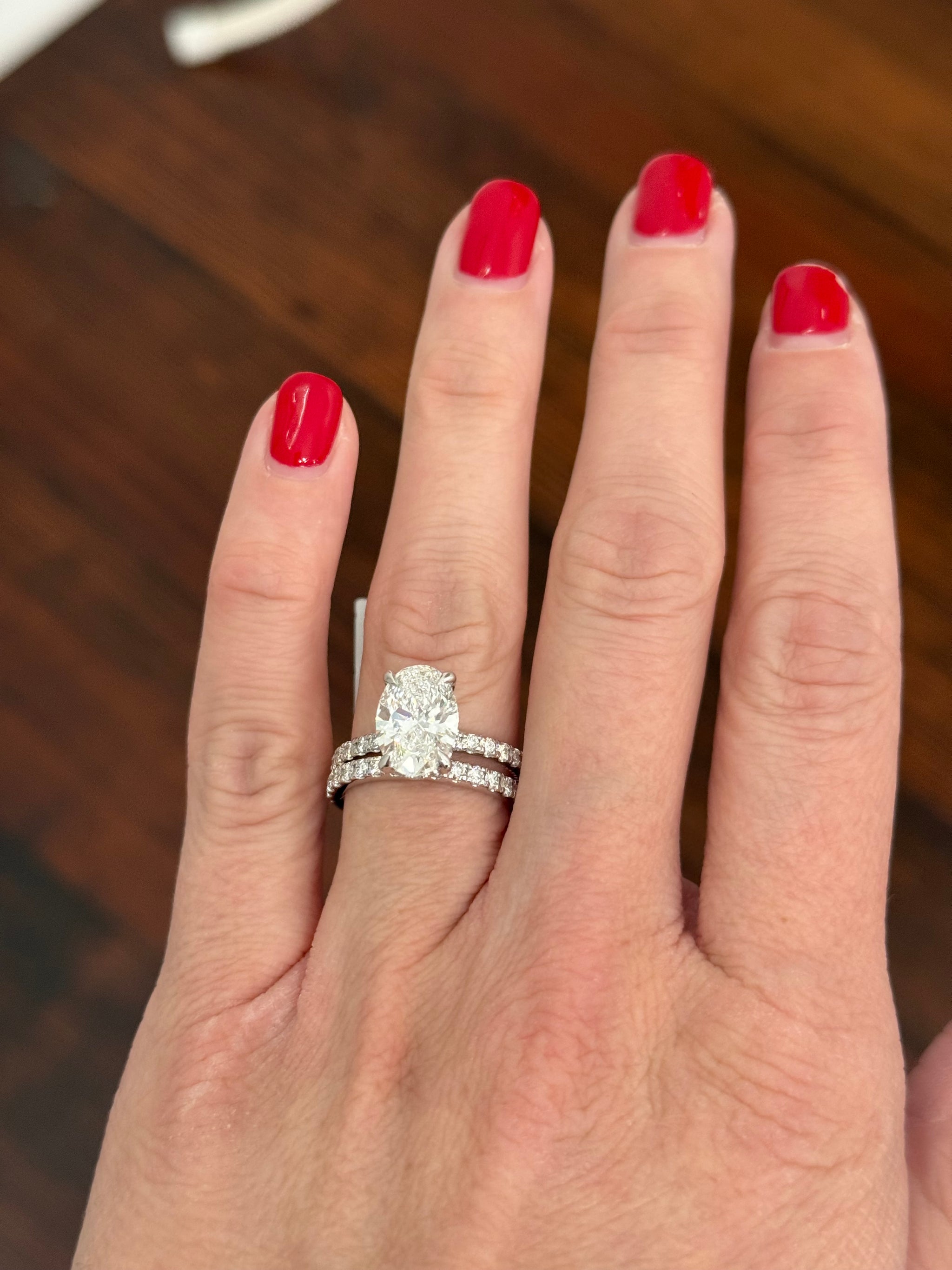 White gold oval lab diamond ring. Center stone is IGI certified and 3.03cts E VVS2