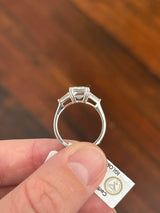 White gold IGI certified emerald cut and tapered baguette lab diamond ring. Center stone is 3.06cts