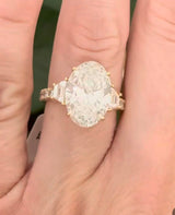 IGI certified oval and trapezoid and round lab diamond ring. Center stone is 6.52cts