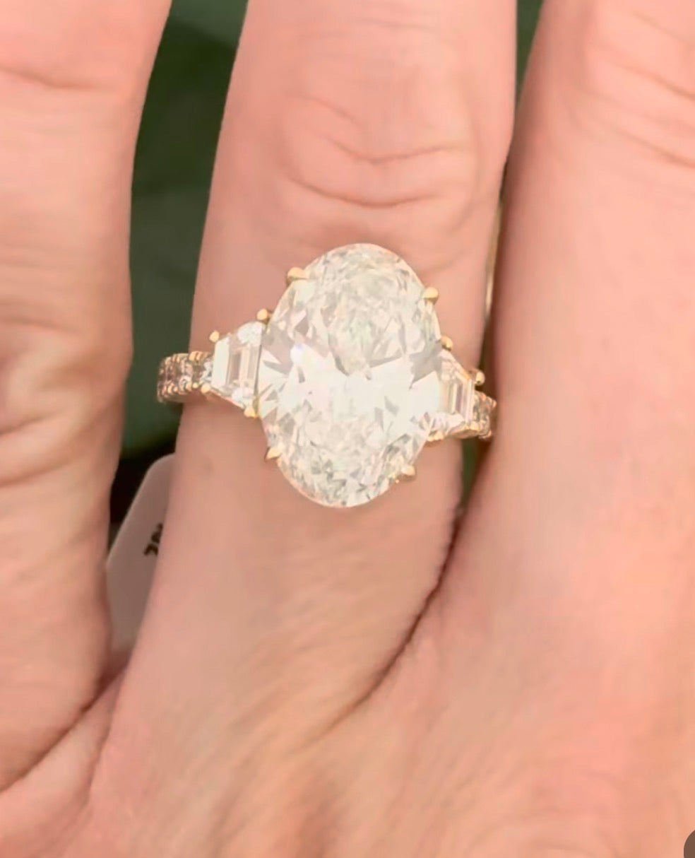 IGI certified oval and trapezoid and round lab diamond ring. Center stone is 6.52cts