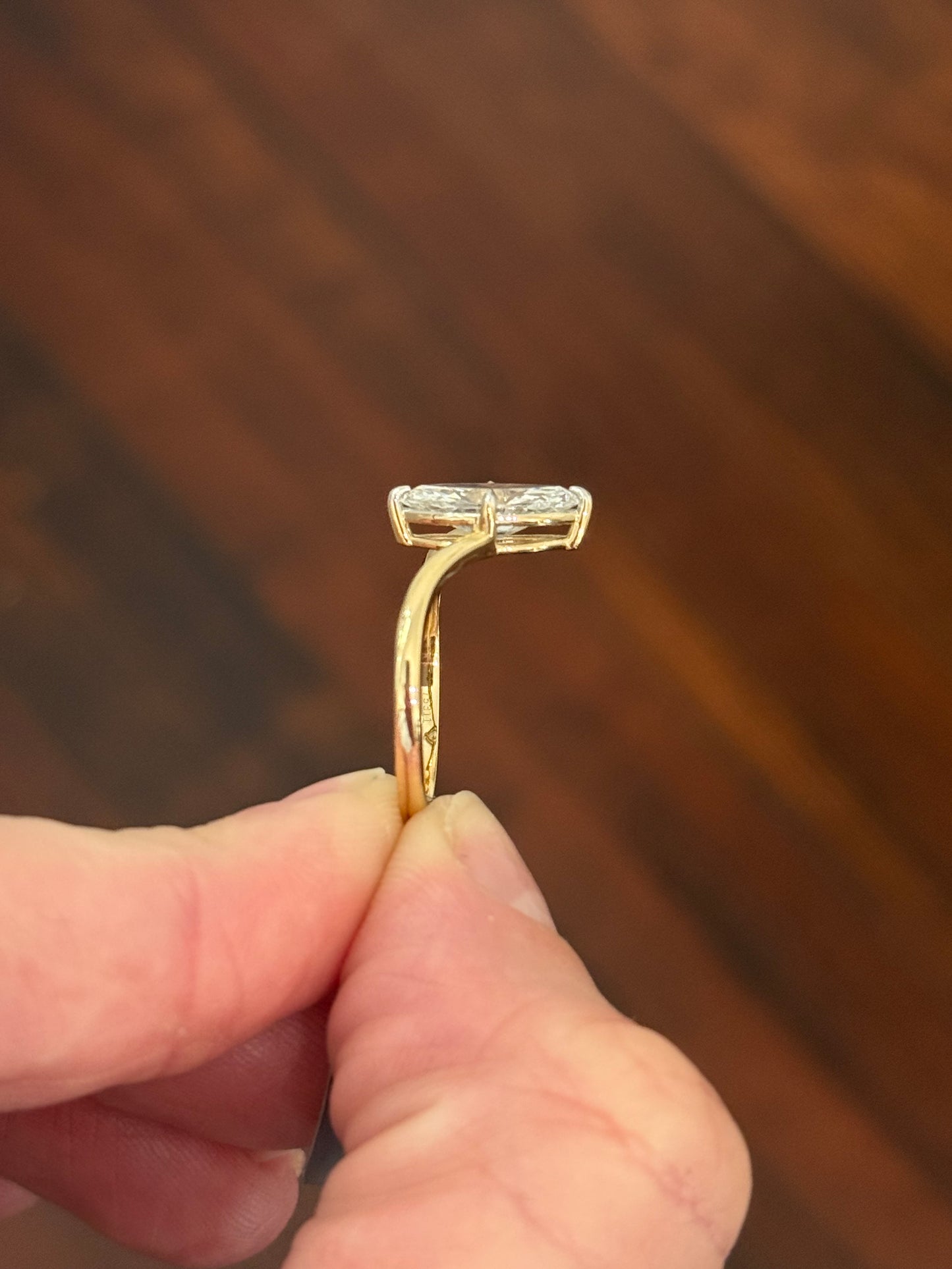 Yellow gold 1.49ct marquise lab diamond ring. Prongs are white gold.