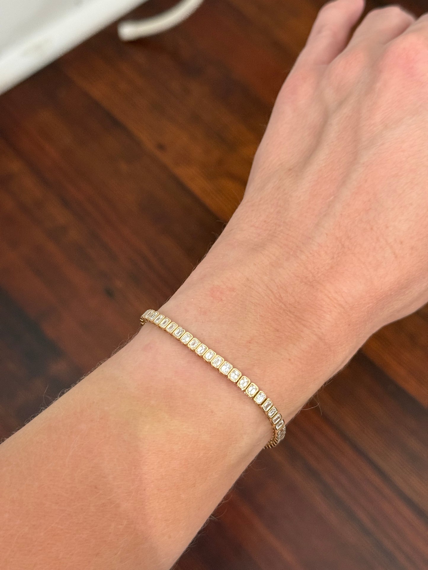 Yellow gold bezel set 5.15ct emerald cut natural diamond bracelet
