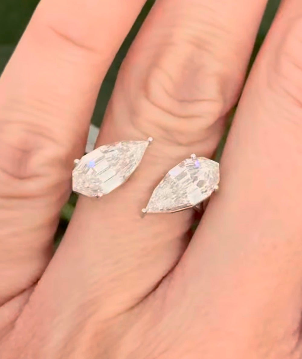 White gold 4.38ct step cut pear lab diamond bypass ring. Each measures 12.78x6.10mm