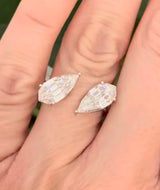 White gold 4.38ct step cut pear lab diamond bypass ring. Each measures 12.78x6.10mm