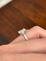 White gold IGI certified emerald cut and tapered baguette lab diamond ring. Center stone is 3.06cts