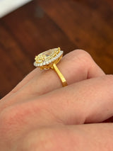 Yellow gold pear shape yellow lab diamond and white lab diamond ring
