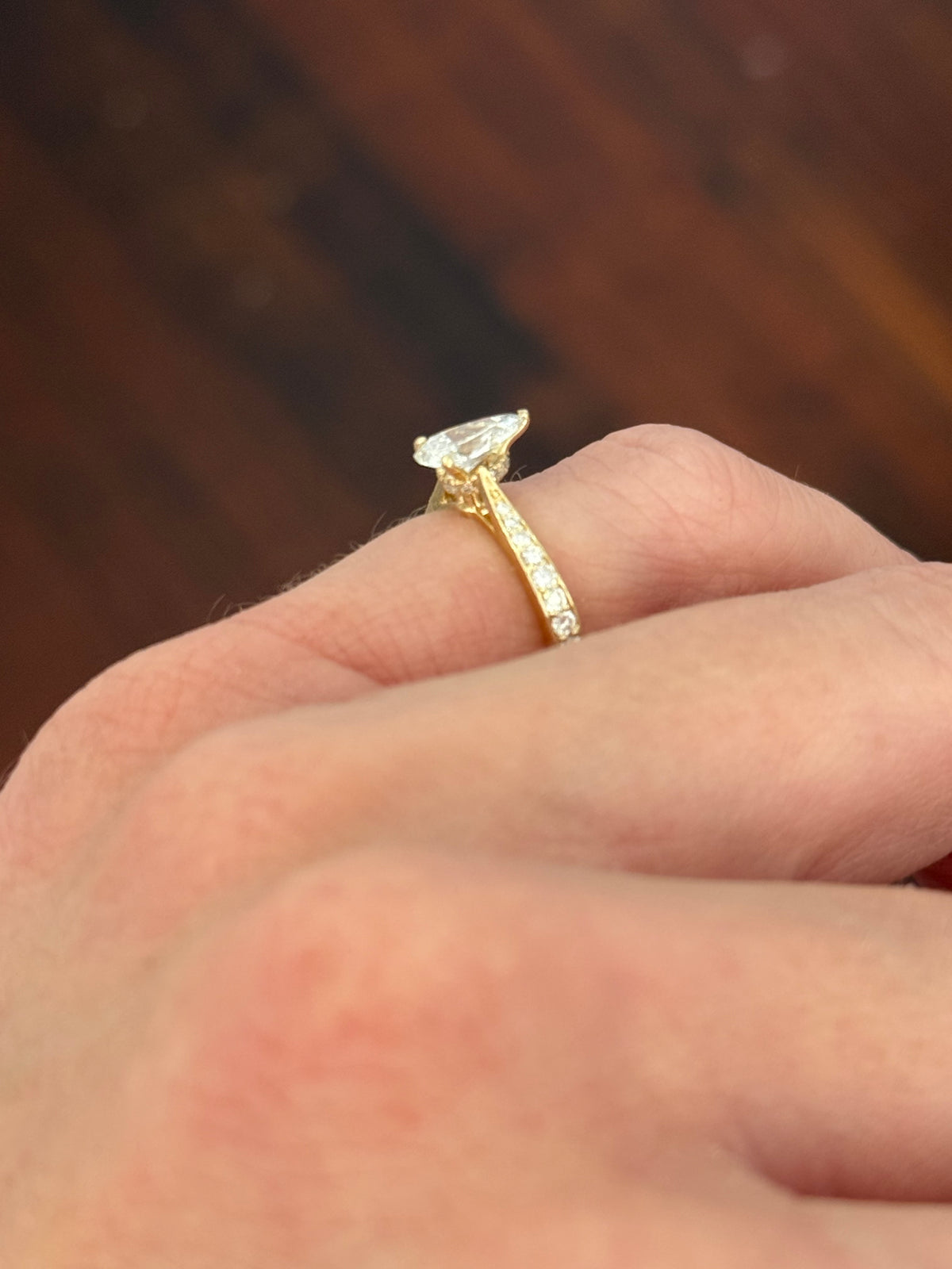 Size 3.75 IGI certified yellow gold pear and round lab diamond ring. Center stone is 0.58cts