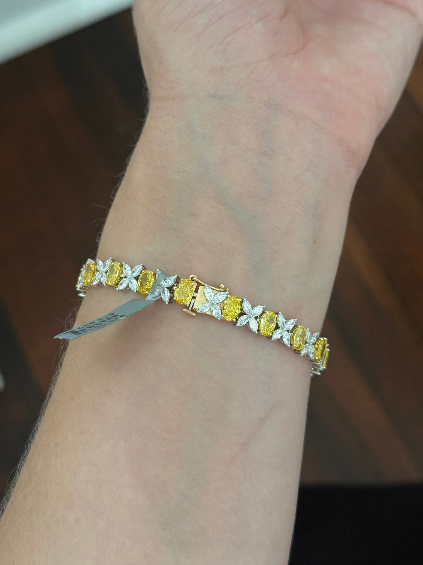 Yellow and white gold oval yellow lab diamond and marquise white lab diamond bracelet. Yellow lab diamonds are set in yellow gold and white lab diamonds are set in white gold.