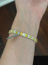 Yellow and white gold oval yellow lab diamond and marquise white lab diamond bracelet. Yellow lab diamonds are set in yellow gold and white lab diamonds are set in white gold.