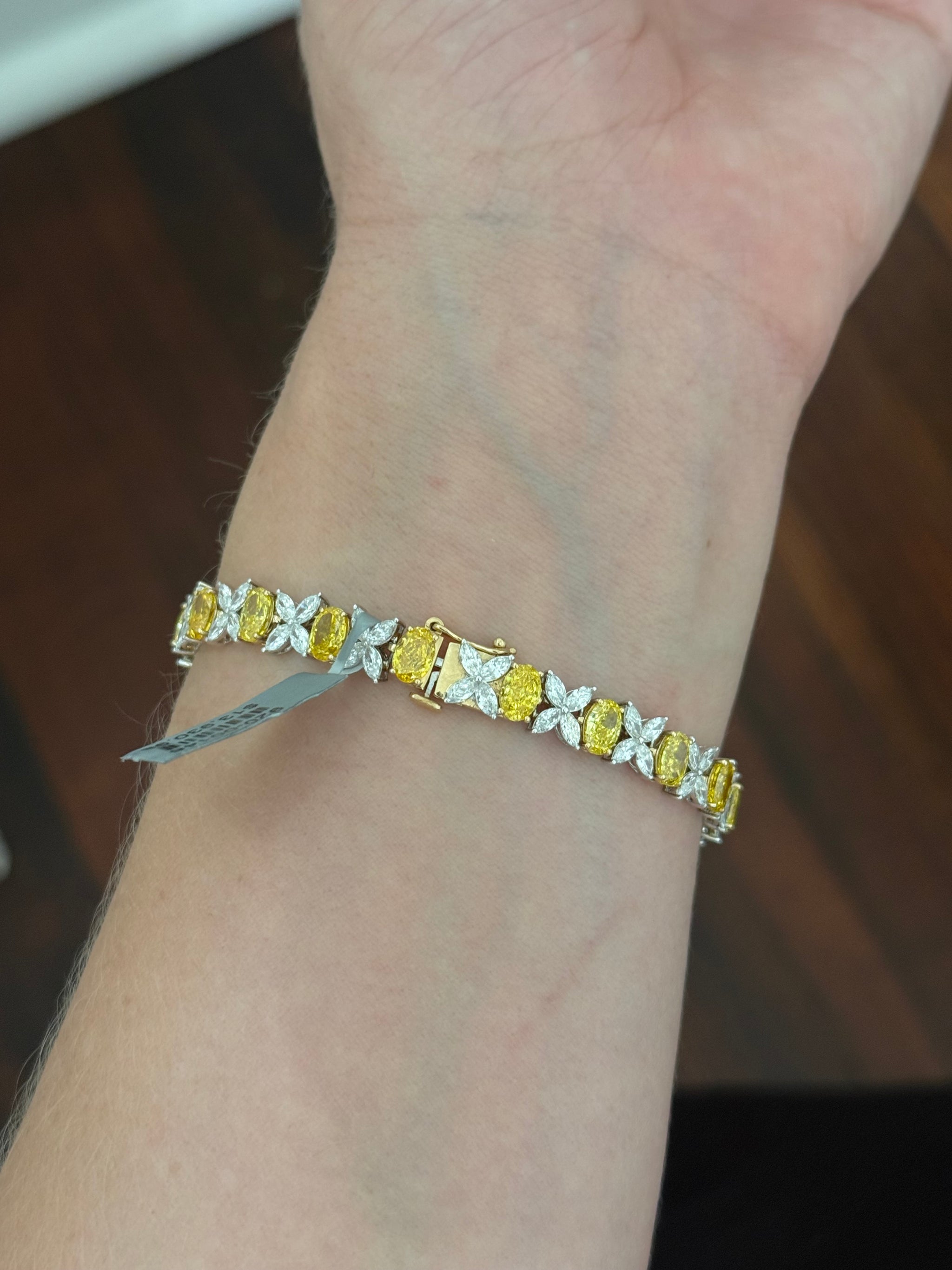 Yellow and white gold oval yellow lab diamond and marquise white lab diamond bracelet. Yellow lab diamonds are set in yellow gold and white lab diamonds are set in white gold.