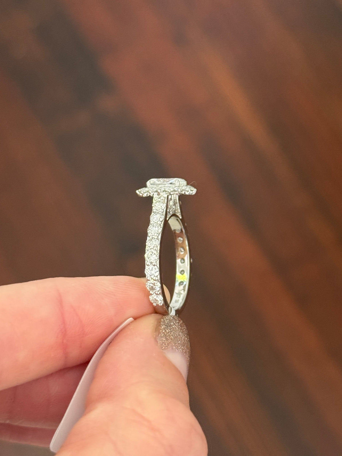 White gold cushion and round lab diamond ring. Center stone is 1ct and 7.1x4.8mm