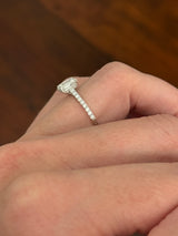 White gold 1.35ct emerald cut lab diamond ring. Center stone is 1.09cts and measures 6.7x4.3mm