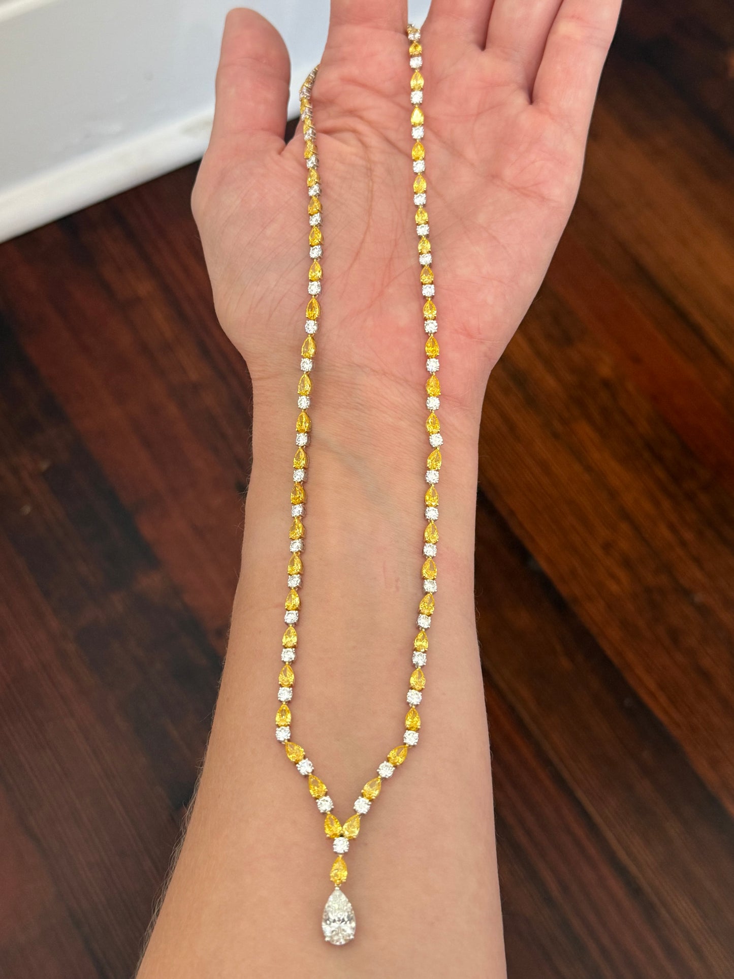 White gold pear shape yellow and white lab diamond and round white lab diamond necklace. Center stone is IGI certified and 1.86cts D VVS2