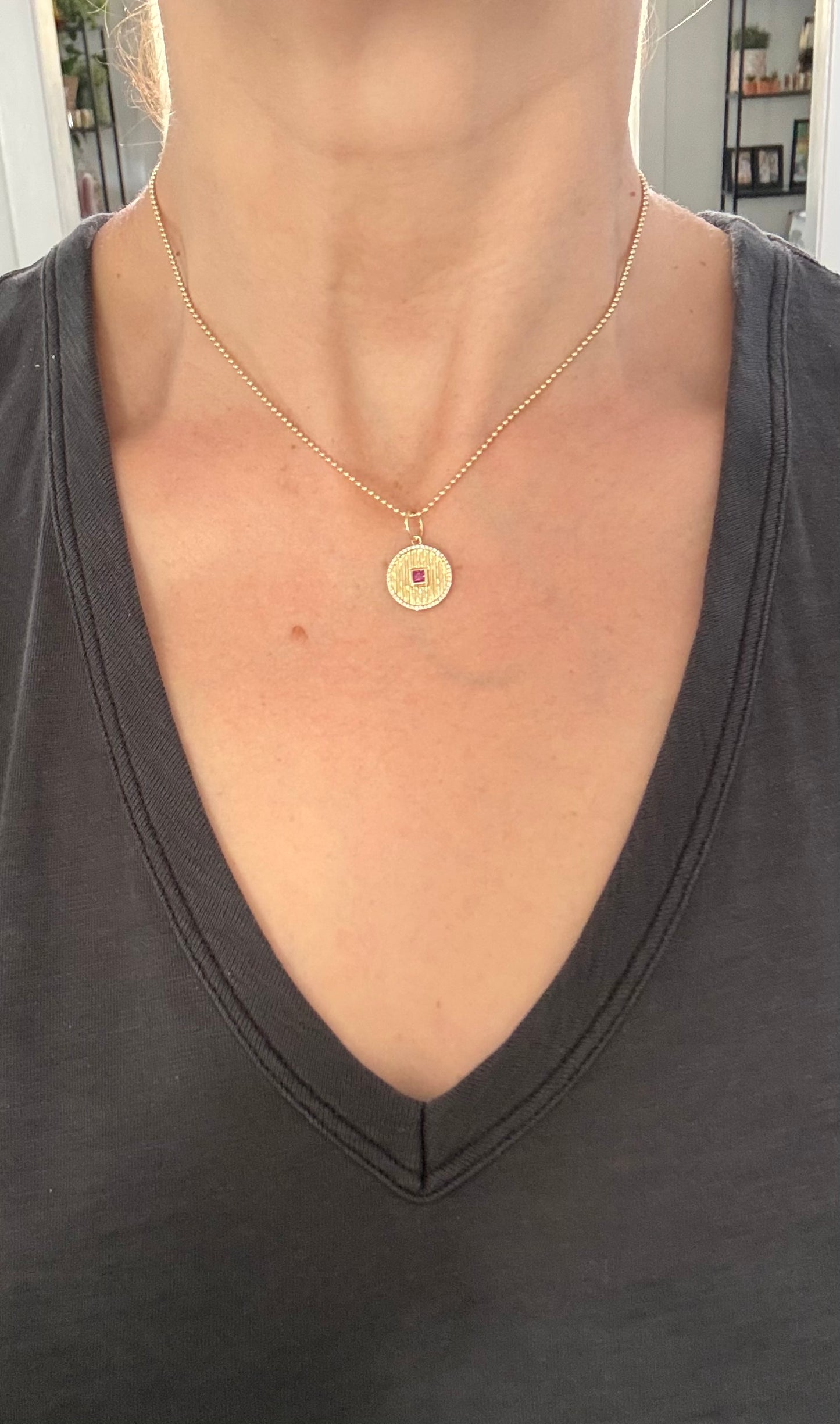Yellow gold natural diamond pendants available with emerald or ruby