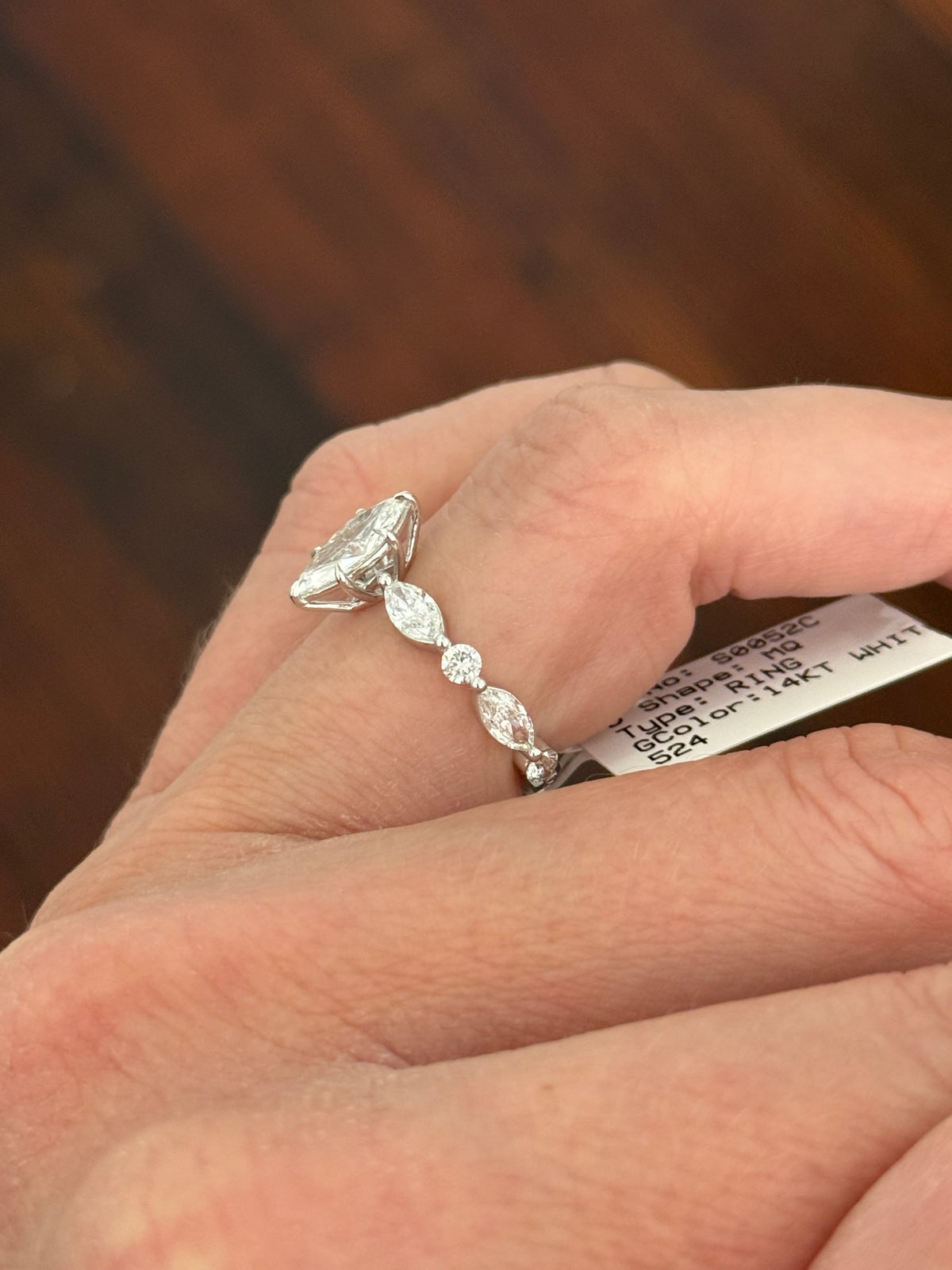White gold marquise and round lab diamond ring. Center stone is 0.9cts and approximately 10x4.5mn
