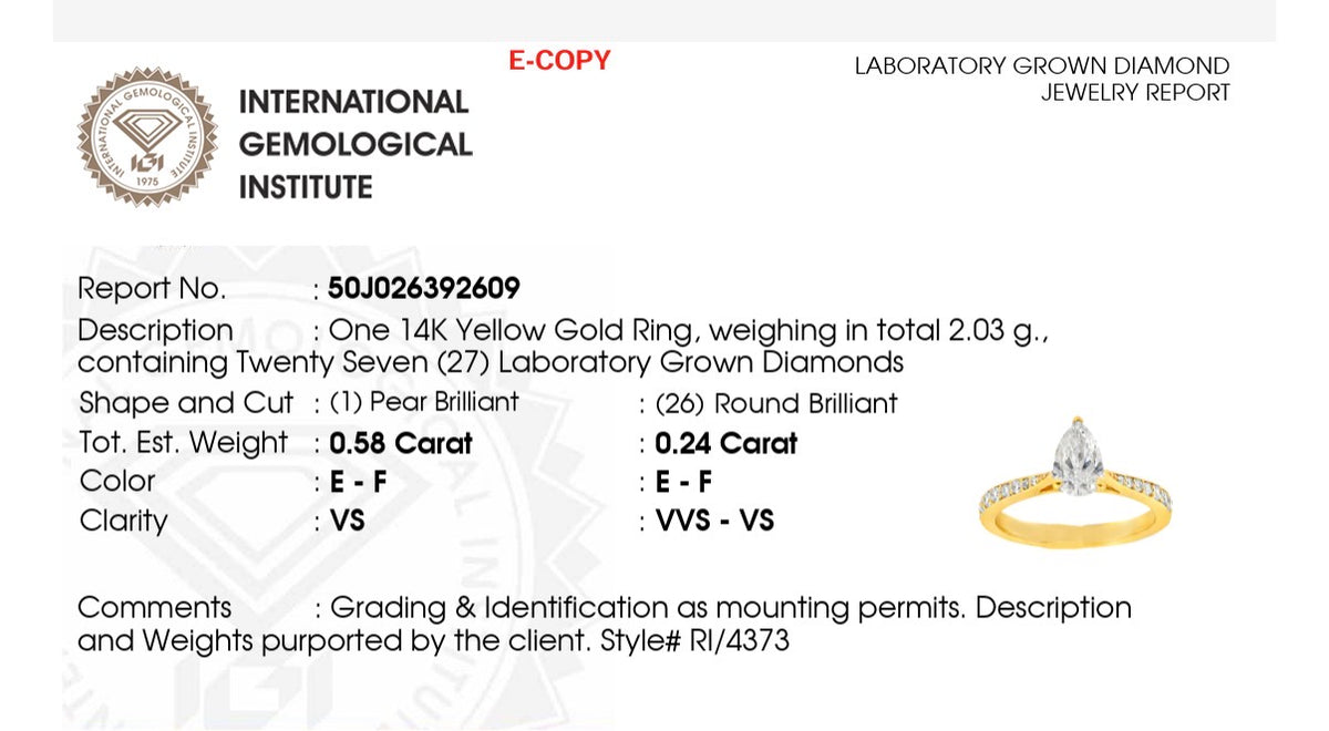 Size 3.75 IGI certified yellow gold pear and round lab diamond ring. Center stone is 0.58cts