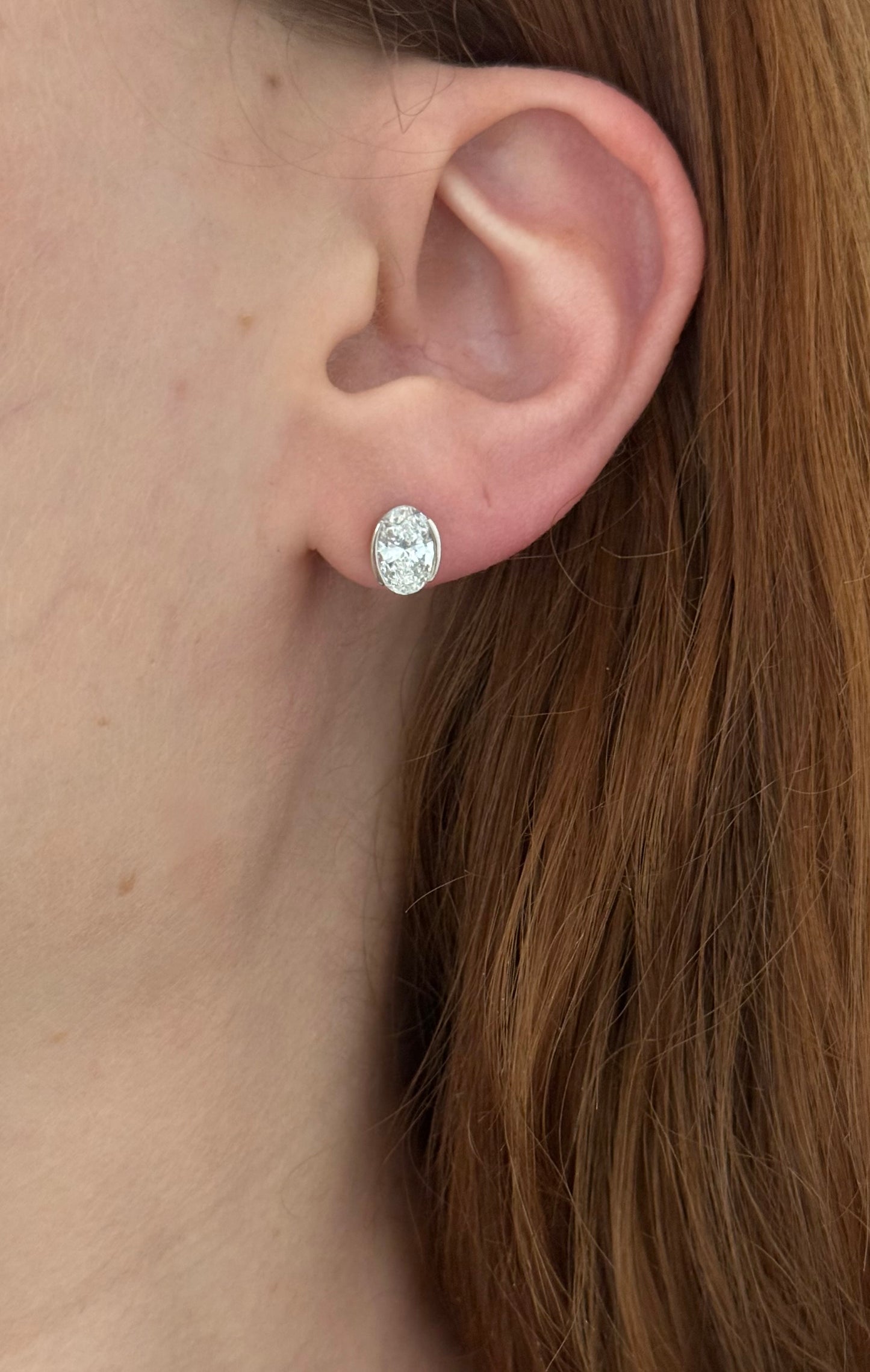 White gold bezel set oval lab diamond stud earrings
