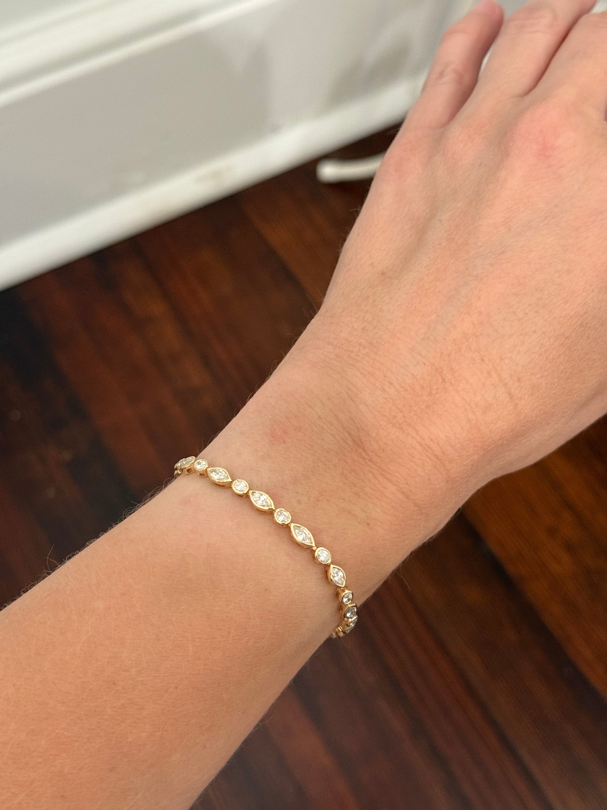 Yellow gold bezel set 4.36ct marquise and oval natural diamond bracelet