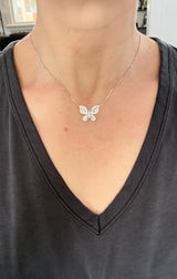 Butterfly necklaces with baguette and round diamonds available in white and yellow gold