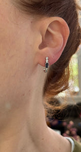 Natural diamond screw back earrings available in yellow gold with rubies and white gold with sapphires
