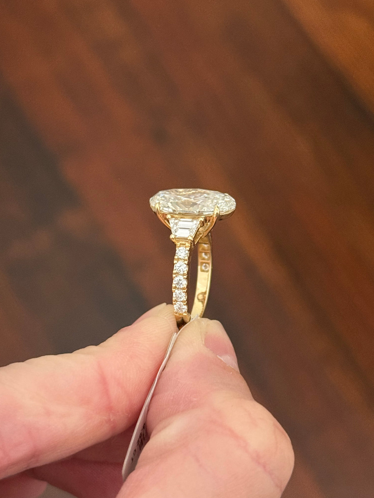 IGI certified oval and trapezoid and round lab diamond ring. Center stone is 6.52cts