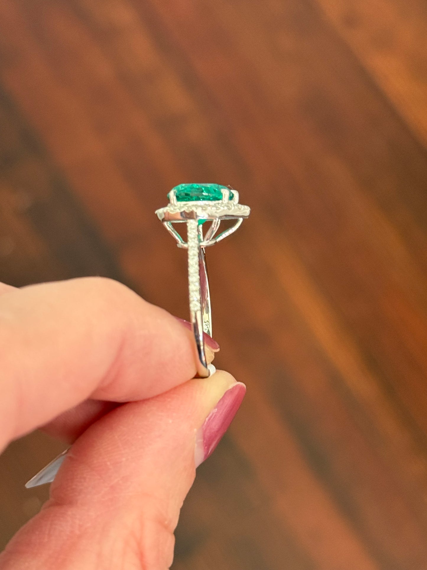 White gold heart shape lab emerald and round lab diamond ring