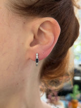 Natural diamond screw back earrings available in yellow gold with rubies and white gold with sapphires