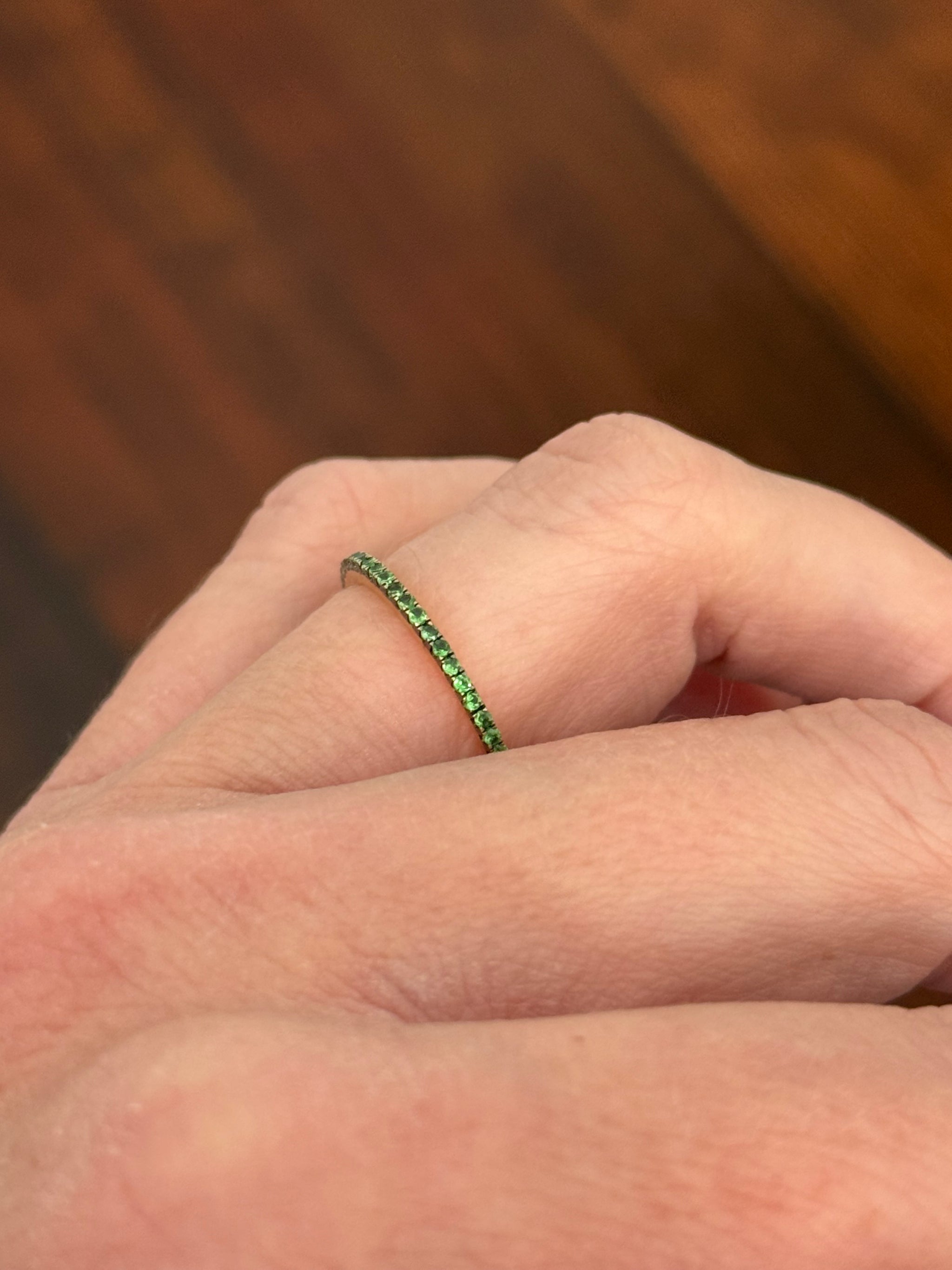 Yellow gold tsavorite eternity band