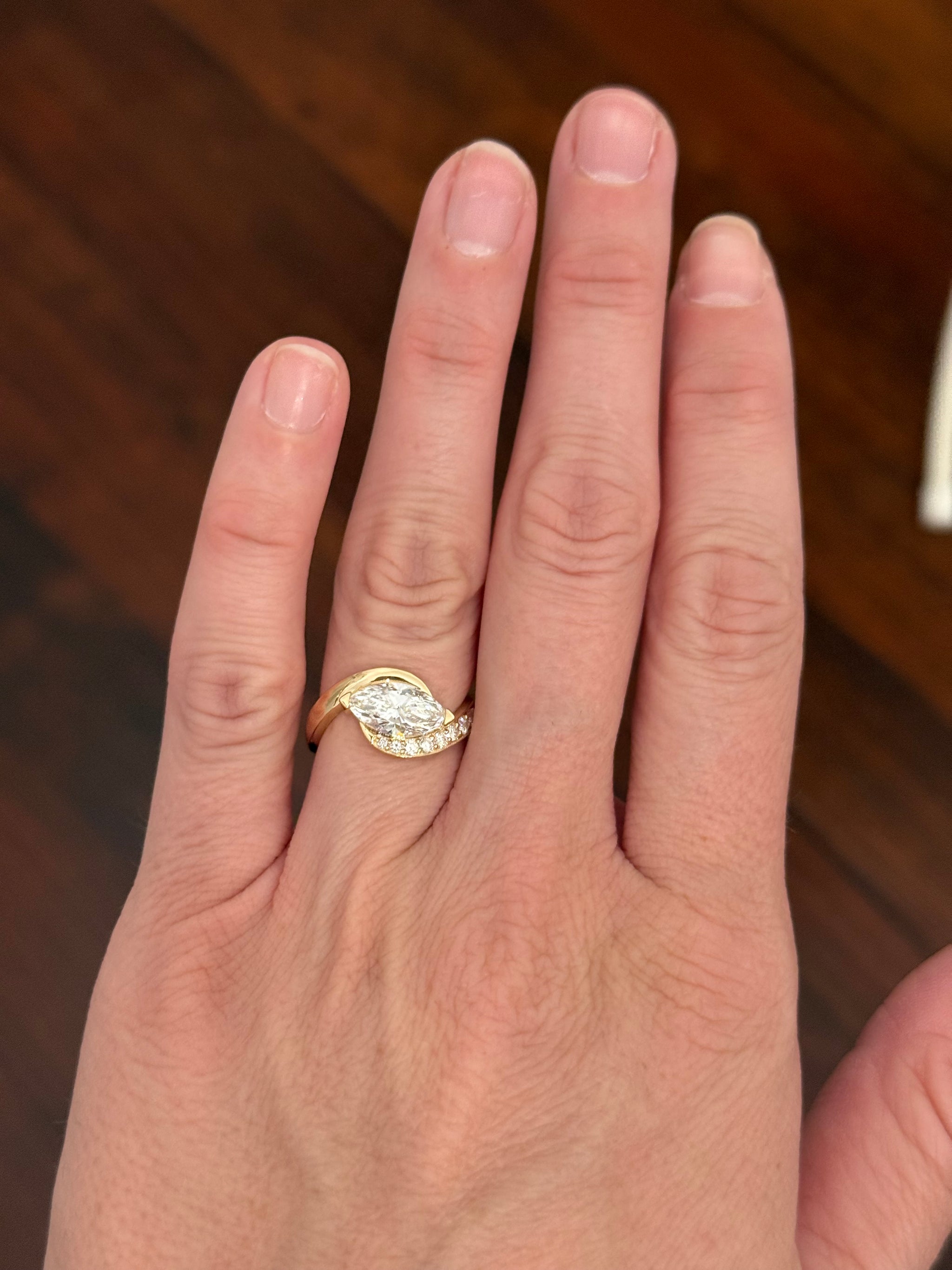 Yellow gold east west set marquise and round lab diamond ring. Marquise is IGI certified and 1.59cts E VS1