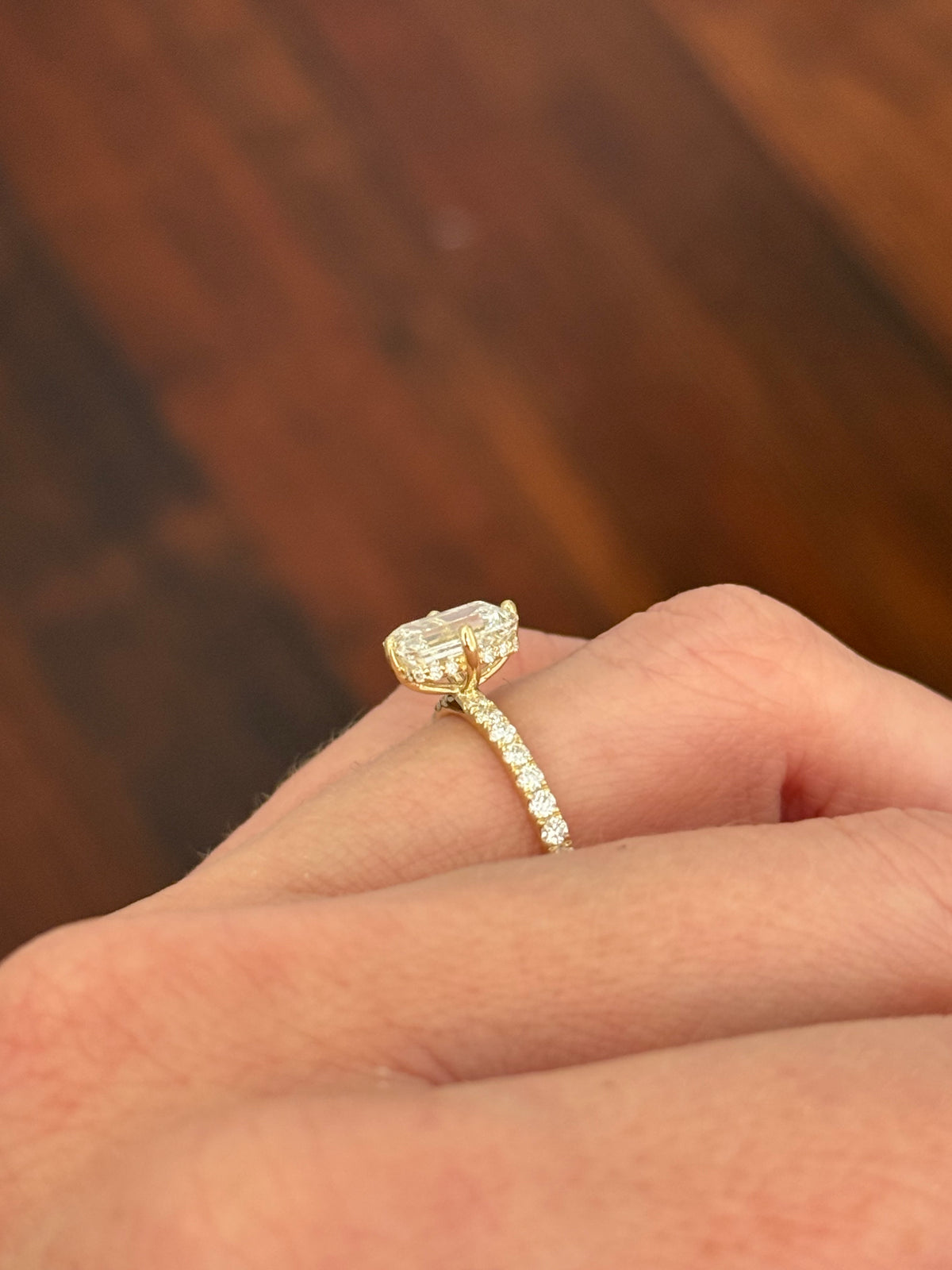 IGI certified yellow gold emerald cut and round lab diamond ring. Center stone is 1.86cts