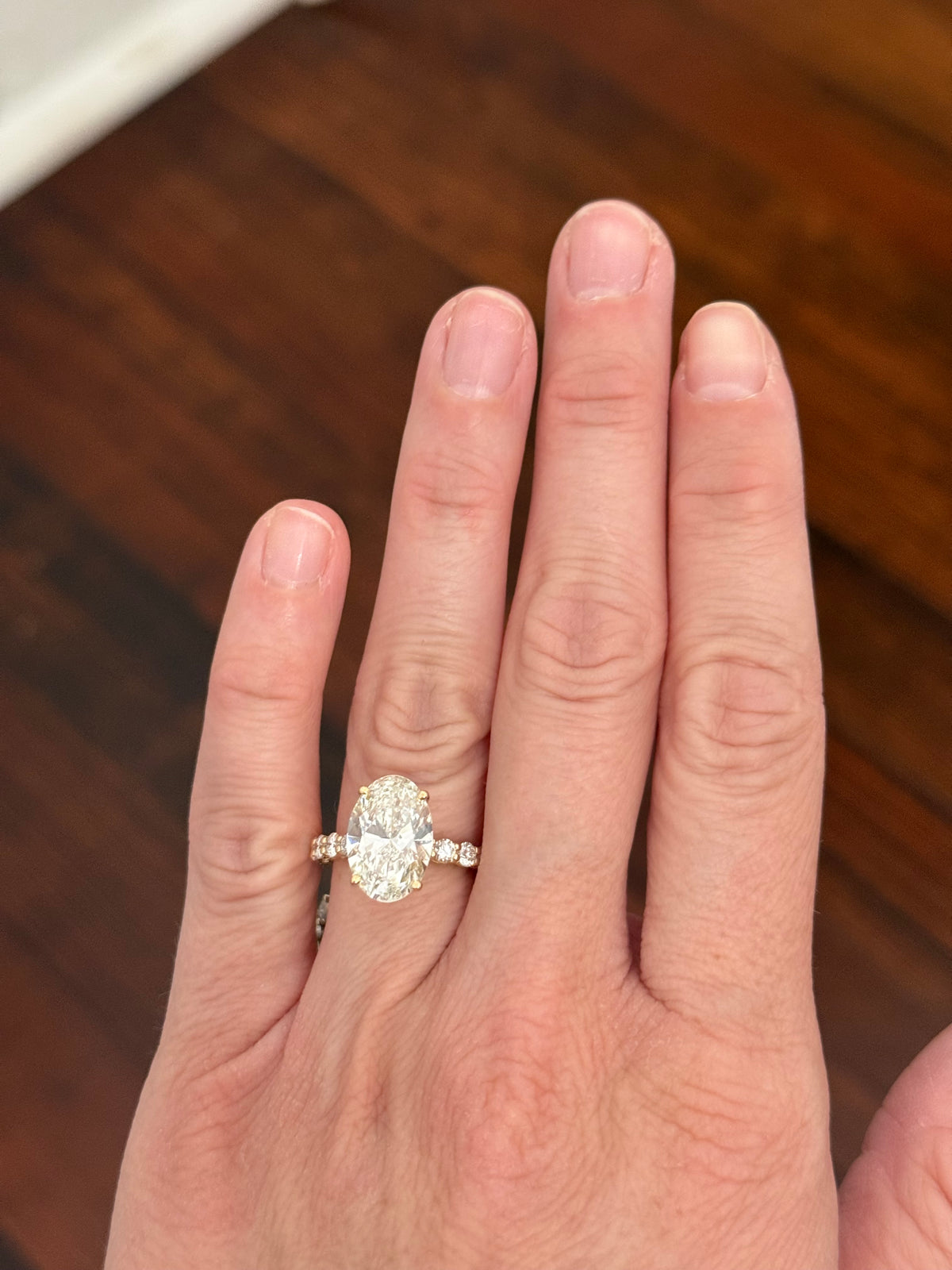 Yellow gold oval and round lab diamond ring and band set. Center stone is 5.1cts